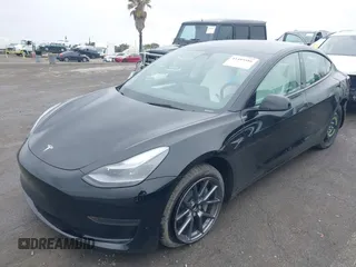 2023 Tesla Model 3 with VIN 5YJ3E1EA0PF587656, listed as a IAAI auction lot 41489586 with 12,844 mi miles and . Bid and sale history available at DreamBid. Image 2.