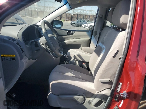2011 Kia Sedona LX with VIN KNDMG4C75B6410550, listed as a Copart auction lot 76997744 with 74,659 mi miles and Salvage Title. Bid and sale history available at carsss.com. Image 7.