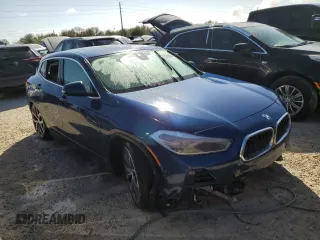 2021 BMW X2 sDrive28i with VIN WBXYH9C02M5S54591, listed as a Copart auction lot 77223834 with 0 mi miles and Salvage Title. Bid and sale history available at carsss.com. Image 4.