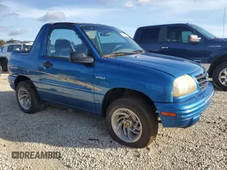 2001 Suzuki Vitara JLS z VIN 2S3TC52C116101163, wystawiony jako Copart lot #74469744 z przebiegiem Nie podano mil oraz Szkody całkowita. Historia ofert i sprzedaży dostępna na DreamBid. Obrazek 4.