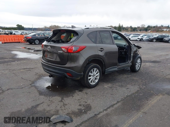 2016 Mazda CX-5 Touring with VIN JM3KE4CY5G0695242, listed as a IAAI auction lot 41795135 with 195,162 mi miles. Bid and sale history available at carsss.com. Image 4.