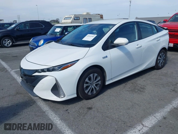 2021 Toyota Prius LE with VIN JTDKAMFP7M3197111, listed as a IAAI auction lot 42031569 with 240,098 mi miles and . Bid and sale history available at DreamBid. Image 2.