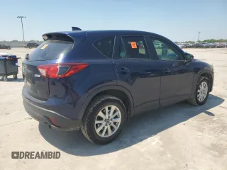 2014 Mazda CX-5 Touring z VIN JM3KE2CYXE0327950, wystawiony jako Copart lot #51390585 z przebiegiem 129 523 mil mil oraz Czysty tytuł • Clean title. Historia ofert i sprzedaży dostępna na DreamBid. Obrazek 3.