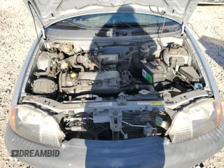 2001 Suzuki Swift GA z VIN 2S2AB21H516602339, wystawiony jako Copart lot #50135584 z przebiegiem 142 476 mil mil oraz Szkody całkowita. Historia ofert i sprzedaży dostępna na DreamBid. Obrazek 13.