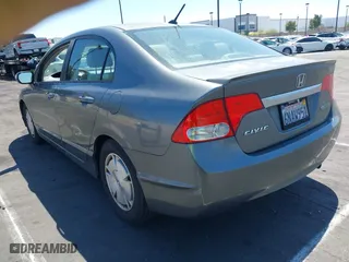 2010 Honda Civic Hybrid with VIN JHMFA3F29AS005350, listed as a IAAI auction lot 41966454 with 145,058 mi miles. Bid and sale history available at carsss.com. Image 3.