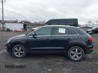 2015 Audi Q3 Premium Plus z VIN WA1EFCFS6FR012425, wystawiony jako IAAI lot #42042484 z przebiegiem 139 012 mil mil oraz . Historia ofert i sprzedaży dostępna na DreamBid. Obrazek 14.