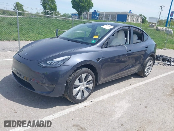 2023 Tesla Model Y Long Range z VIN 7SAYGDEE1PA158661, wystawiony jako IAAI lot #41983897 z przebiegiem 20 176 mil mil oraz . Historia ofert i sprzedaży dostępna na DreamBid. Obrazek 2.