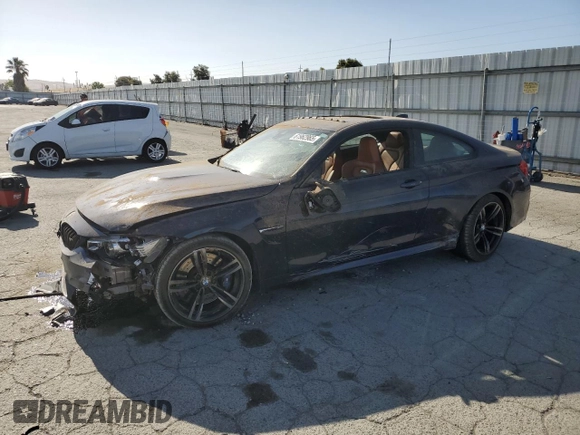 2015 BMW M4 with VIN WBS3R9C50FK335084, listed as a Copart auction lot 61962965 with 142,157 mi miles and Salvage title. Bid and sale history available at DreamBid. Image 1.