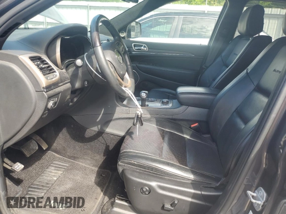 2014 Jeep Grand Cherokee Summit with VIN 1C4RJFJT4EC346946, listed as a Copart auction lot 60613025 with 50,565 mi miles and Salvage title. Bid and sale history available at DreamBid. Image 7.