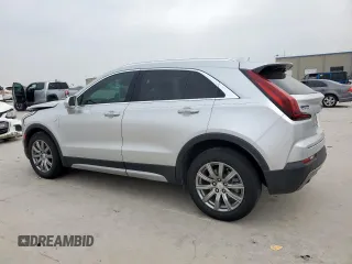 2020 Cadillac XT4 FWD Premium Luxury z VIN 1GYFZCR42LF115413, wystawiony jako Copart lot #56746785 z przebiegiem 41 296 mil mil oraz Szkody całkowita. Historia ofert i sprzedaży dostępna na DreamBid. Obrazek 2.