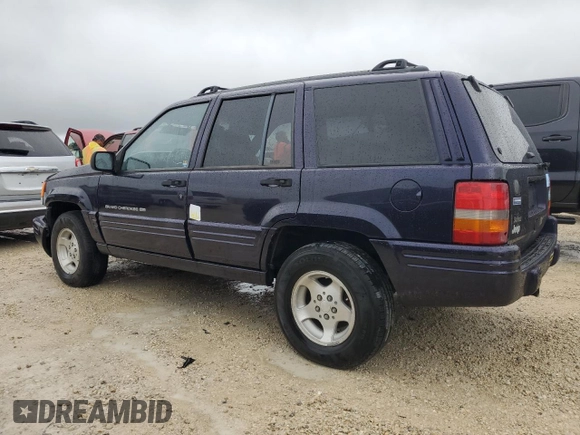 1998 Jeep Grand Cherokee with VIN 1J4FX48S1WC244308, listed as a Copart auction lot 74384714 with Not provided miles and Non repairable. Bid and sale history available at DreamBid. Image 2.
