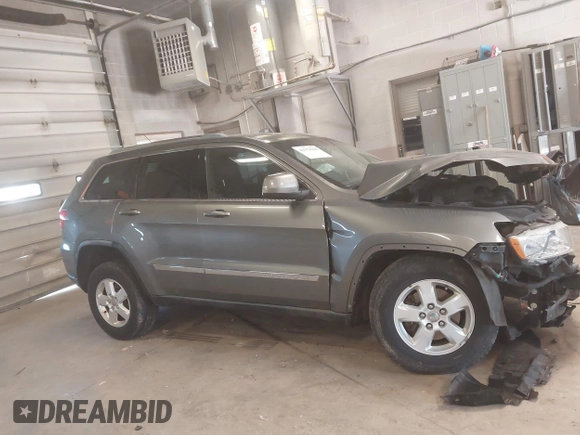 2012 Jeep Grand Cherokee Laredo with VIN 1C4RJFAG3CC209142, listed as a IAAI auction lot 41978296 with 201,796 mi miles. Bid and sale history available at carsss.com. Image 13.