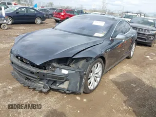 2015 Tesla Model S 85D with VIN 5YJSA1E21FF116775, listed as a IAAI auction lot 41876772 with 128,805 mi miles. Bid and sale history available at carsss.com. Image 20.