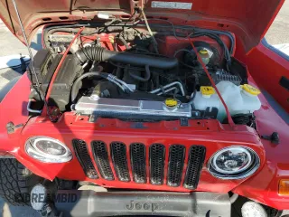 2003 Jeep Wrangler Sport z VIN 1J4FA49S33P302780, wystawiony jako Copart lot #60354805 z przebiegiem 201 679 mil mil oraz Szkoda całkowita • Salvage title. Historia ofert i sprzedaży dostępna na DreamBid. Obrazek 11.