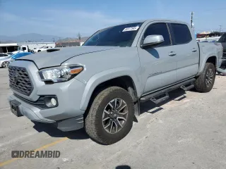 2020 Toyota Tacoma SR5 with VIN 3TMAZ5CN2LM137991, listed as a Copart auction lot 60317895 with 98,054 mi miles and Salvage title. Bid and sale history available at DreamBid. Image 1.