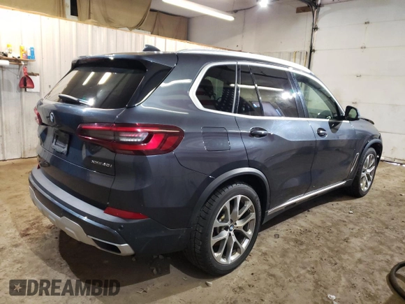 2021 BMW X5 xDrive40i with VIN 5UXCR6C06M9E05140, listed as a Copart auction lot 52402475 with 47,869 mi miles and Salvage title. Bid and sale history available at DreamBid. Image 3.