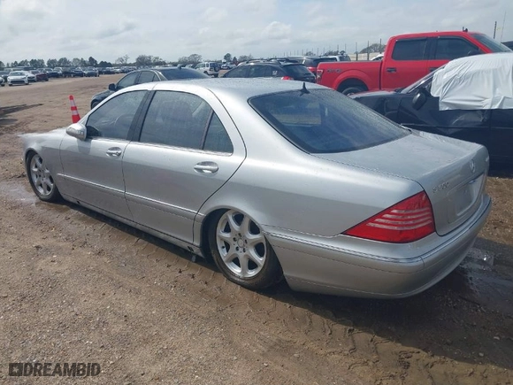 2005 Mercedes-Benz S-Class 5.0L with VIN WDBNG84J55A458443, listed as a IAAI auction lot 41804975 with 180,101 mi miles. Bid and sale history available at carsss.com. Image 3.