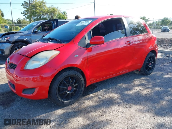 2009 Toyota Yaris with VIN JTDJT903695234623, listed as a IAAI auction lot 42027852 with 146,000 mi miles. Bid and sale history available at carsss.com. Image 17.