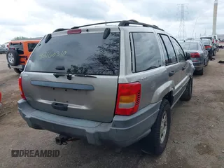 2001 Jeep Grand Cherokee Laredo z VIN 1J4GW48S01C658017, wystawiony jako IAAI lot #42160310 z przebiegiem 220 309 mil mil oraz . Historia ofert i sprzedaży dostępna na DreamBid. Obrazek 4.