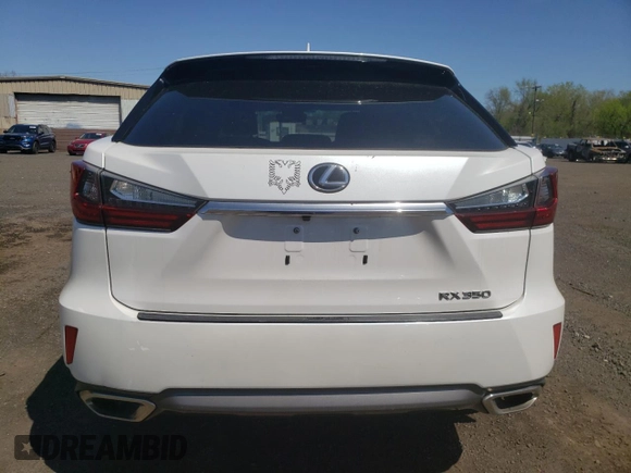 2016 Lexus RX 350 z VIN 2T2BZMCA3GC012763, wystawiony jako Copart lot #54926255 z przebiegiem 58 693 mil mil oraz Szkoda całkowita • Salvage title. Historia ofert i sprzedaży dostępna na DreamBid. Obrazek 6.