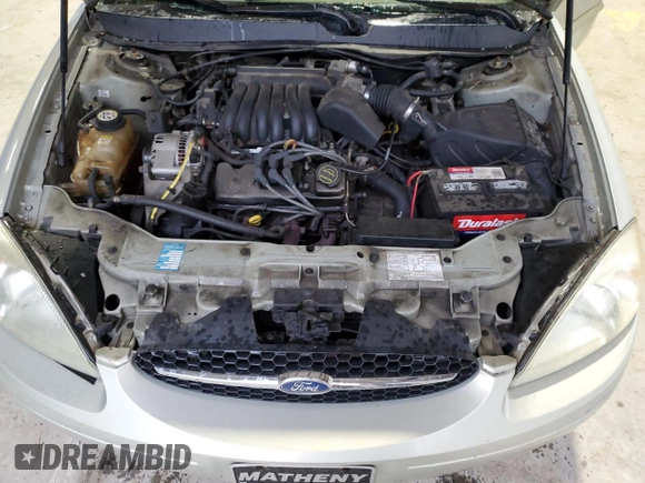 2003 Ford Taurus SE Standard z VIN 1FAFP532X3A195612, wystawiony jako Copart lot #54016645 z przebiegiem 143 168 mil mil oraz Szkoda całkowita • Salvage title. Historia ofert i sprzedaży dostępna na DreamBid. Obrazek 11.