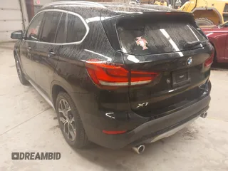 2021 BMW X1 xDrive28i with VIN WBXJG9C00M5T76421, listed as a IAAI auction lot 41918429 with 29,971 mi miles. Bid and sale history available at carsss.com. Image 3.