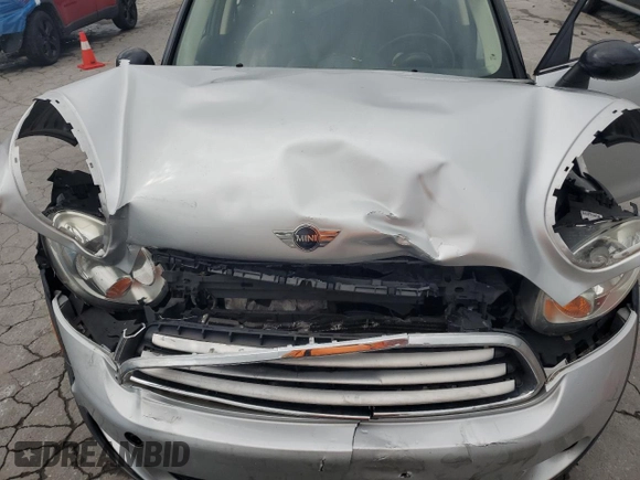 2012 MINI Countryman with VIN WMWZB3C5XCWM06778, listed as a Copart auction lot 61201285 with 64,676 mi miles and Salvage title. Bid and sale history available at DreamBid. Image 11.