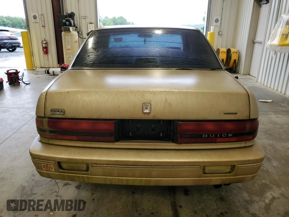 1993 Buick Regal Custom with VIN 2G4WB54L4P1411904, listed as a Copart auction lot 56564455 with 112,248 mi miles and Salvage title. Bid and sale history available at DreamBid. Image 6.