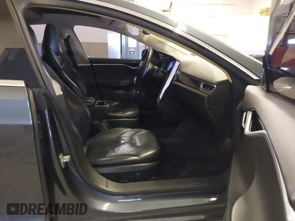 2014 Tesla Model S 60 with VIN 5YJSA1H13EFP49912, listed as a IAAI auction lot 41716661 with 129,776 mi miles and . Bid and sale history available at DreamBid. Image 5.