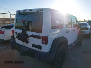 2014 Jeep Wrangler Unlimited Sahara with VIN 1C4BJWEG0EL273475, listed as a IAAI auction lot 41515425 with 128,900 mi miles. Bid and sale history available at carsss.com. Image 4.