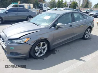 2014 Ford Fusion SE Hybrid with VIN 3FA6P0LU4ER195506, listed as a IAAI auction lot 41859599 with 159,374 mi miles. Bid and sale history available at carsss.com. Image 4.