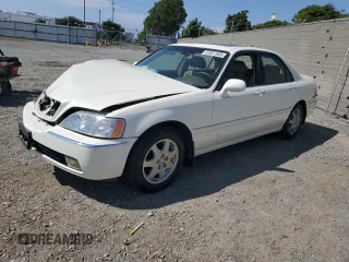 2002 Acura RL with VIN JH4KA96522C011028, listed as a Copart auction lot 61027505 with 104,094 mi miles and Salvage title. Bid and sale history available at DreamBid. Image 1.