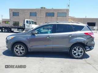 2013 Ford Escape SEL with VIN 1FMCU0HX0DUC16069, listed as a IAAI auction lot 42638924 with 80,200 mi miles and . Bid and sale history available at DreamBid. Image 14.