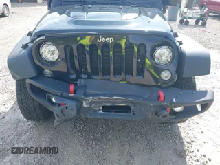 2017 Jeep Wrangler Unlimited Rubicon Recon z VIN 1C4HJWFG4HL507601, wystawiony jako IAAI lot #42258921 z przebiegiem 106 122 mil mil oraz . Historia ofert i sprzedaży dostępna na DreamBid. Obrazek 6.
