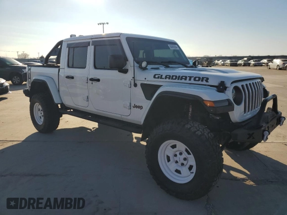 2022 Jeep Gladiator Rubicon with VIN 1C6JJTBG5NL152818, listed as a Copart auction lot 80095554 with 9,579 mi miles and Salvage title. Bid and sale history available at DreamBid. Image 4.