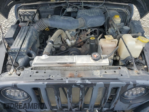 1999 Jeep Wrangler SE z VIN 1J4FY29P0XP479580, wystawiony jako Copart lot #63075455 z przebiegiem 160 986 mil mil oraz Szkoda całkowita • Salvage title. Historia ofert i sprzedaży dostępna na DreamBid. Obrazek 11.