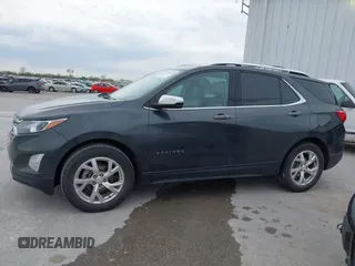 2021 Chevrolet Equinox Premier z VIN 2GNAXNEV9M6140537, wystawiony jako IAAI lot #42016514 z przebiegiem 52 237 mil mil oraz . Historia ofert i sprzedaży dostępna na DreamBid. Obrazek 14.