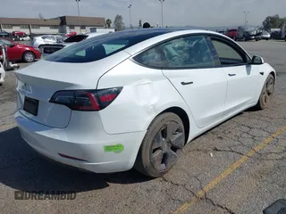 2023 Tesla Model 3 with VIN 5YJ3E1EA8PF398110, listed as a IAAI auction lot 41692006 with 112,699 mi miles and . Bid and sale history available at carsss.com. Image 4.