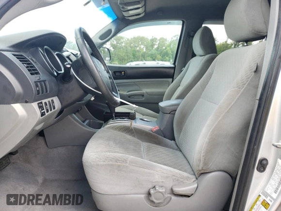 2010 Toyota Tacoma PreRunner with VIN 3TMJU4GNXAM094419, listed as a Copart auction lot 57757185 with 201,490 mi miles and Salvage title. Bid and sale history available at DreamBid. Image 7.