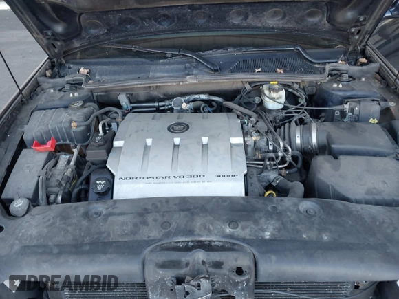 2004 Cadillac DeVille DTS z VIN 1G6KF57934U181654, wystawiony jako IAAI lot #41752298 z przebiegiem 131 861 mil mil oraz . Historia ofert i sprzedaży dostępna na DreamBid. Obrazek 10.
