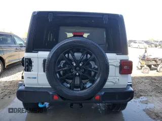 2023 Jeep Wrangler Sahara z VIN 1C4JJXP6XPW696247, wystawiony jako Copart lot #54222575 z przebiegiem 39 797 mil mil oraz Nie do naprawy • Non repairable. Historia ofert i sprzedaży dostępna na DreamBid. Obrazek 6.