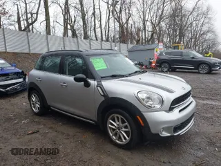 2015 MINI Cooper Countryman S with VIN WMWZC5C5XFWP44579, listed as a IAAI auction lot 41852834 with 112,341 mi miles. Bid and sale history available at carsss.com. Image 1.