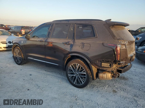 2023 Cadillac XT6 AWD Sport z VIN 1GYKPGRS6PZ108561, wystawiony jako Copart lot #71052284 z przebiegiem 31 496 mil mil oraz Szkoda całkowita • Salvage title. Historia ofert i sprzedaży dostępna na DreamBid. Obrazek 2.