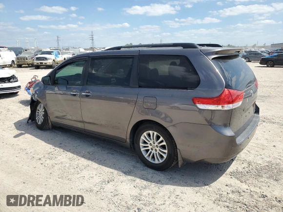 2012 Toyota Sienna XLE AAS with VIN 5TDYK3DCXCS199580, listed as a Copart auction lot 52455405 with 113,259 mi miles and Salvage Title. Bid and sale history available at DreamBid. Image 2.