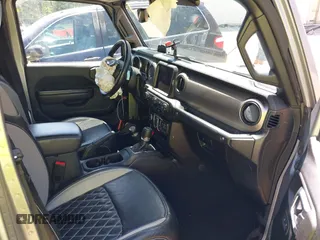 2021 Jeep Gladiator Willys z VIN 1C6HJTAG6ML507039, wystawiony jako IAAI lot #42057637 z przebiegiem 69 443 mil mil oraz . Historia ofert i sprzedaży dostępna na DreamBid. Obrazek 5.