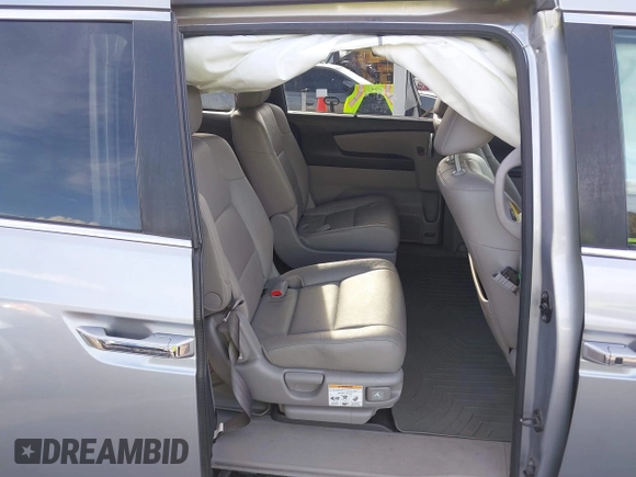 2017 Honda Odyssey EX-L with VIN 5FNRL5H64HB017661, listed as a IAAI auction lot 41719447 with 99,895 mi miles and . Bid and sale history available at DreamBid. Image 8.