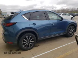 2018 Mazda CX-5 Grand Touring with VIN JM3KFADM8J1351624, listed as a Copart auction lot 50965465 with 66,210 mi miles and Salvage Title. Bid and sale history available at DreamBid. Image 3.
