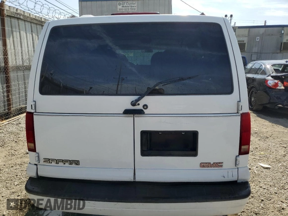 1998 GMC Safari z VIN 1GKDM19W1WB512631, wystawiony jako Copart lot #75899764 z przebiegiem 207 067 mil mil oraz Szkoda całkowita • Salvage title. Historia ofert i sprzedaży dostępna na DreamBid. Obrazek 6.