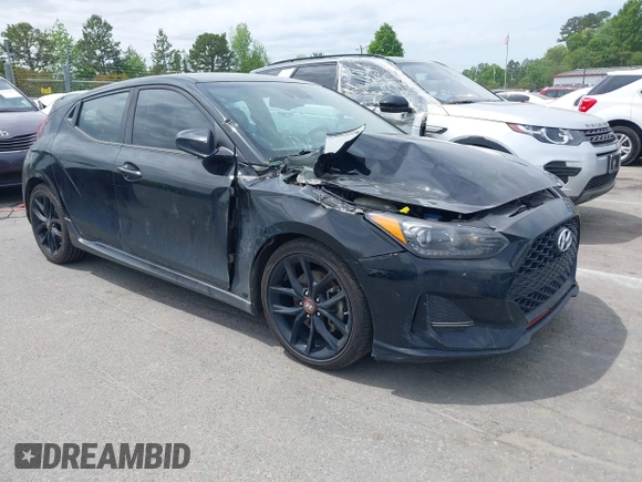 2019 Hyundai Veloster Turbo z VIN KMHTH6AB4KU011518, wystawiony jako IAAI lot #42037553 z przebiegiem 134 250 mil mil oraz . Historia ofert i sprzedaży dostępna na DreamBid. Obrazek 1.