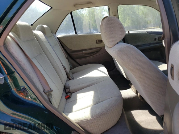 1999 Mazda Protege DX with VIN JM1BJ2223X0139775, listed as a Copart auction lot 54338455 with 63,198 mi miles and Salvage Title. Bid and sale history available at DreamBid. Image 10.